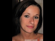 Kirsten plant is sited on a sofa, legs appart and looking at you