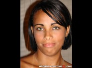 Jessica is sited on a sofa, legs appart and looking at you