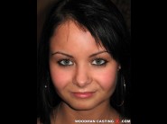 Katalynix is sited on a sofa, legs appart and looking at you