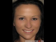 Niki sweet is sited on a sofa, legs appart and looking at you