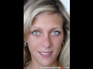 Irina is sited on a sofa, legs appart and looking at you