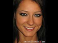 Melisa - a is sited on a sofa, legs appart and looking at you