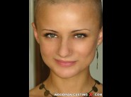 Cj is sited on a sofa, legs appart and looking at you