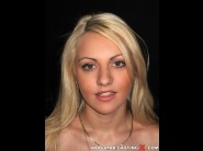 Kristina first is sited on a sofa, legs appart and looking at you