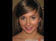 Jessika lux is sited on a sofa, legs appart and looking at you