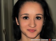 Bonny singer is sited on a sofa, legs appart and looking at you