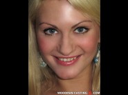 Anita henger is sited on a sofa, legs appart and looking at you