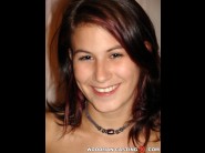 Ander ways is sited on a sofa, legs appart and looking at you