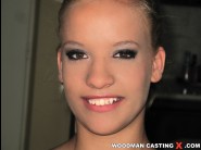 Chanel silk is sited on a sofa, legs appart and looking at you