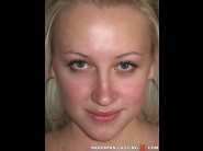 Margareta is sited on a sofa, legs appart and looking at you