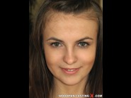 Zanna is sited on a sofa, legs appart and looking at you