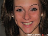 Kaely speed is sited on a sofa, legs appart and looking at you