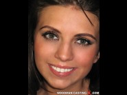 Samantha green is sited on a sofa, legs appart and looking at you