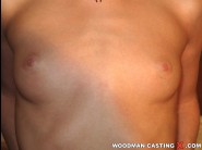 Melany is sited on a sofa, legs appart and looking at you