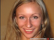 Katija is sited on a sofa, legs appart and looking at you