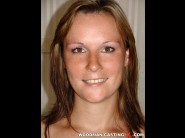 Kristy m is sited on a sofa, legs appart and looking at you