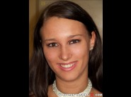 Virginie ducatti is sited on a sofa, legs appart and looking at you