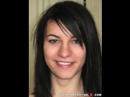 Norah swan is sited on a sofa, legs appart and looking at you