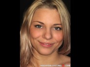 Safi pearl is sited on a sofa, legs appart and looking at you