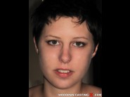 Gabrim is sited on a sofa, legs appart and looking at you