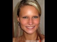 Samantha jolie is sited on a sofa, legs appart and looking at you