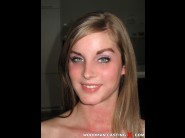 Daisy hot is sited on a sofa, legs appart and looking at you