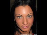 Destiny is sited on a sofa, legs appart and looking at you