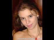 Alysa is sited on a sofa, legs appart and looking at you