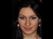 Eugenya is sited on a sofa, legs appart and looking at you