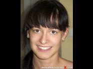 Barbie pink is sited on a sofa, legs appart and looking at you