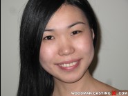 Nicoline is sited on a sofa, legs appart and looking at you