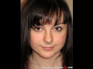 Kirsty jacusy is sited on a sofa, legs appart and looking at you