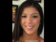 Brittany harper is sited on a sofa, legs appart and looking at you