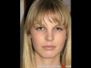 Rose delight is sited on a sofa, legs appart and looking at you