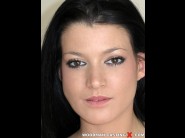 Lana fever is sited on a sofa, legs appart and looking at you