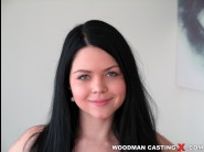 Shione cooper is sited on a sofa, legs appart and looking at you