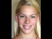 Bernice is sited on a sofa, legs appart and looking at you