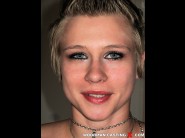 Checky clarig is sited on a sofa, legs appart and looking at you