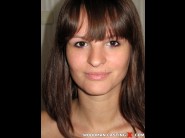 Rita argiles is sited on a sofa, legs appart and looking at you