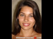 Zafira klass is sited on a sofa, legs appart and looking at you