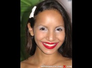 Jade kitti is sited on a sofa, legs appart and looking at you