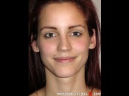 Geraldine konn is sited on a sofa, legs appart and looking at you