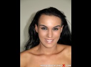 Wild devil is sited on a sofa, legs appart and looking at you