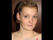  is sited on a sofa, legs appart and looking at you