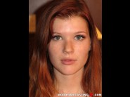 Mia sollis is sited on a sofa, legs appart and looking at you