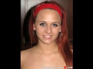 Terry sullivan is sited on a sofa, legs appart and looking at you