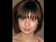 Julie sweet is sited on a sofa, legs appart and looking at you