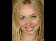 Lina napoli is sited on a sofa, legs appart and looking at you