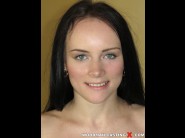 Polly sunshine is sited on a sofa, legs appart and looking at you