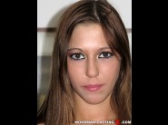 Candy palace is sited on a sofa, legs appart and looking at you